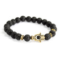Goudkleurige armband Hamsa met lavasteen