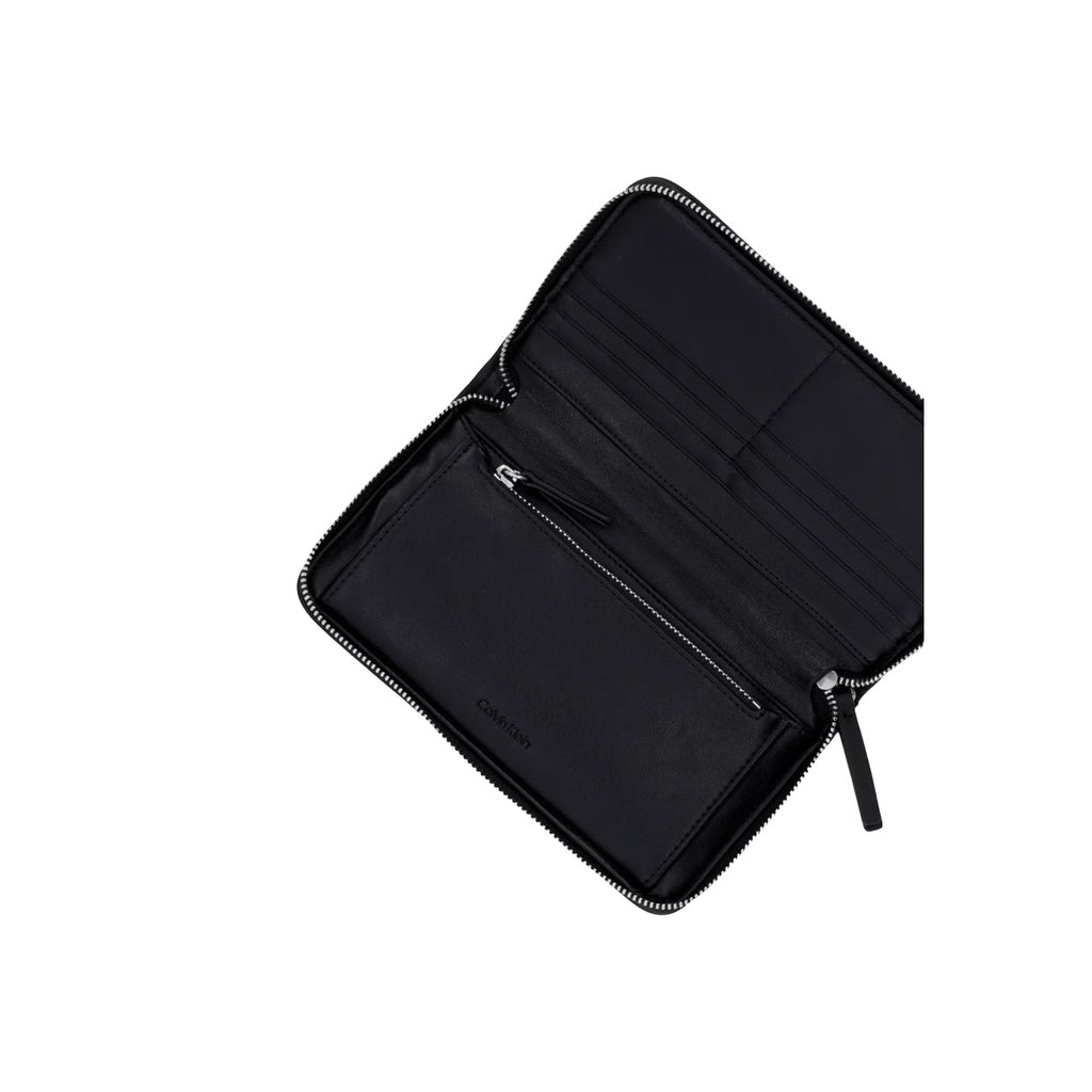 Calvin Klein portemonnee zwart met knopen • zakken: binnenzakken • size (cm): w2 x h11 x l2 (cm)