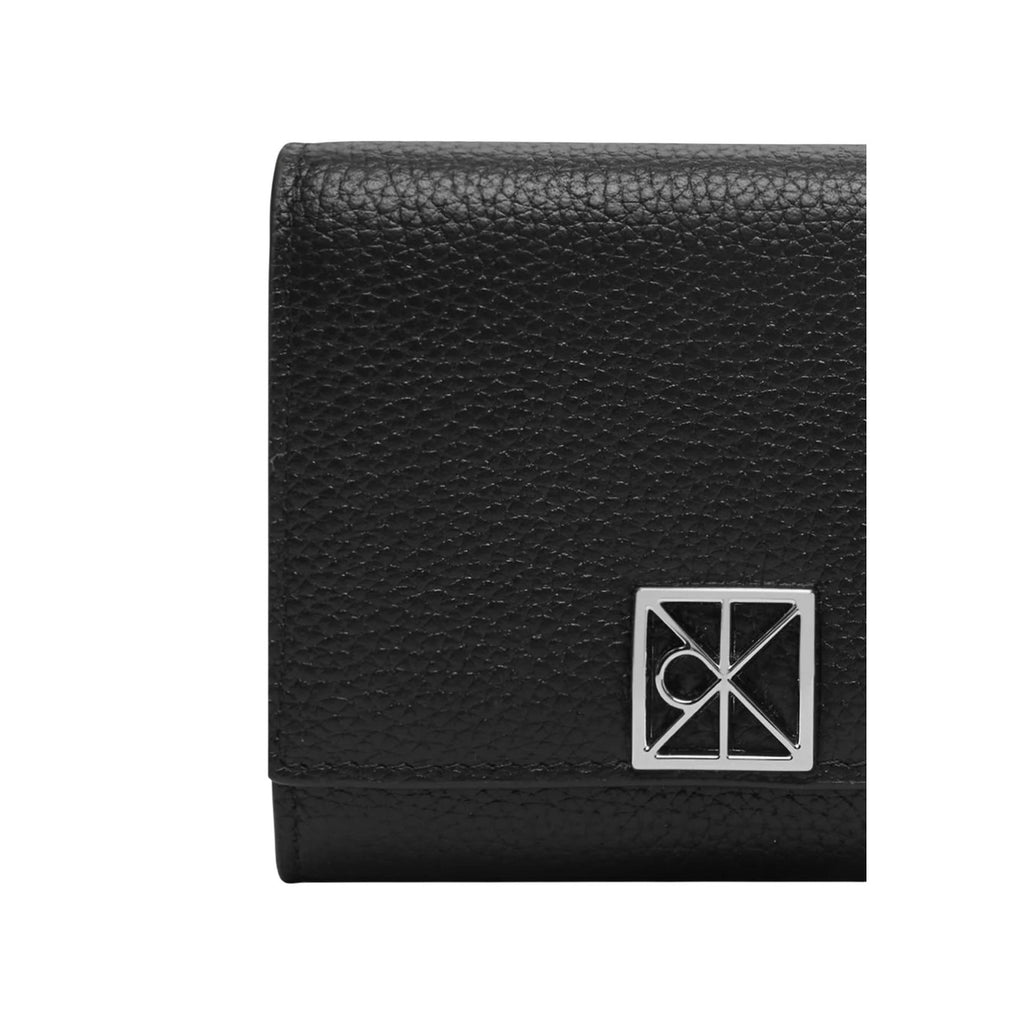 Calvin Klein portemonnee zwart met automatische knoop • size (cm): w10 x h7.5 x l2 (cm)